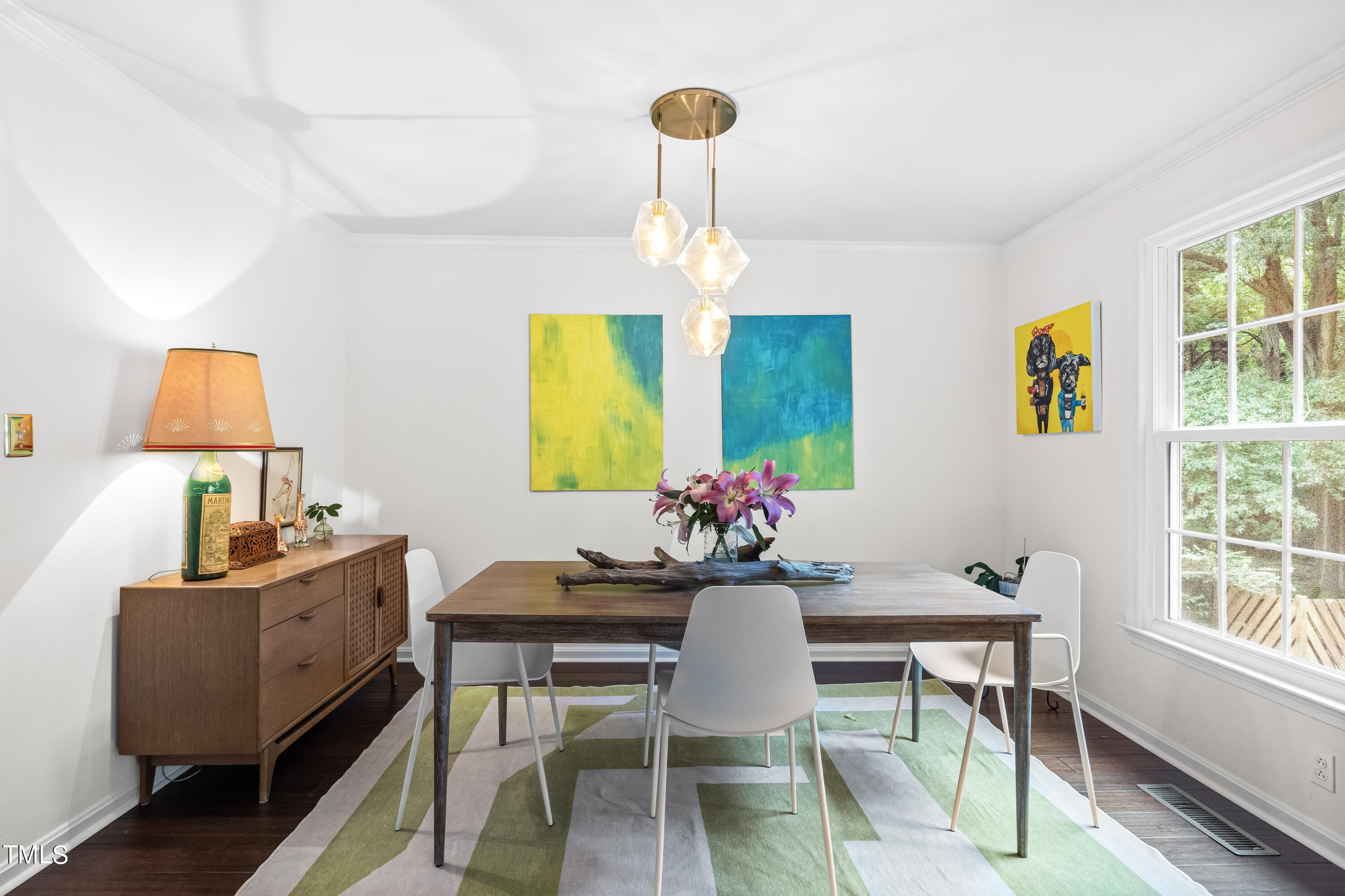 2919 Wycliff Road Raleigh, NC 27607 - Photo 4 of 24 a view of a dining room with furniture and a chandelier