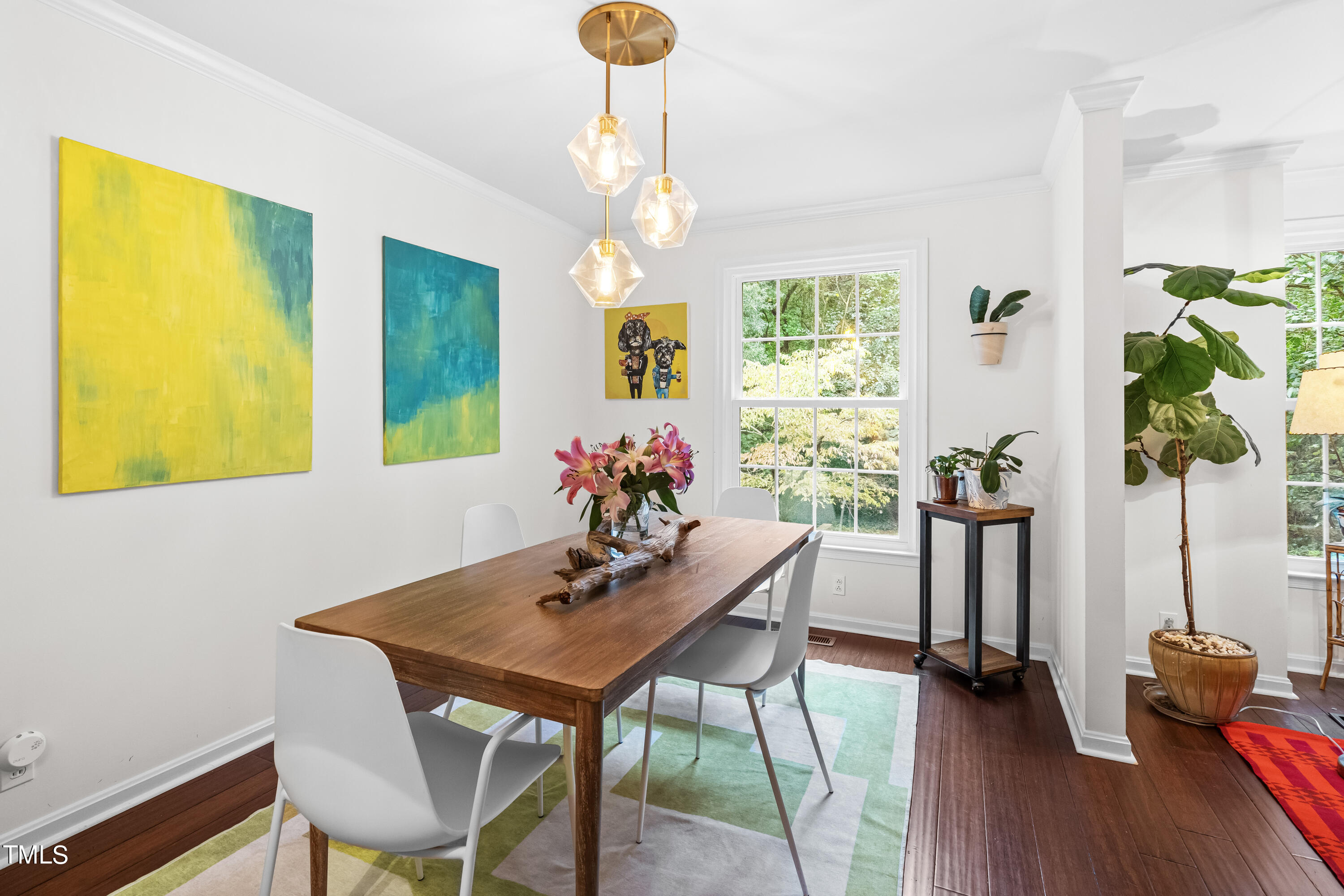 2919 Wycliff Road Raleigh, NC 27607 - Photo 5 of 24 a view of a dining room with furniture and wooden floor