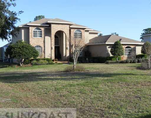 1100 Riverside Ridge Road Tarpon Springs, FL 34688 - Photo 1 of 1 a view of a house with a yard