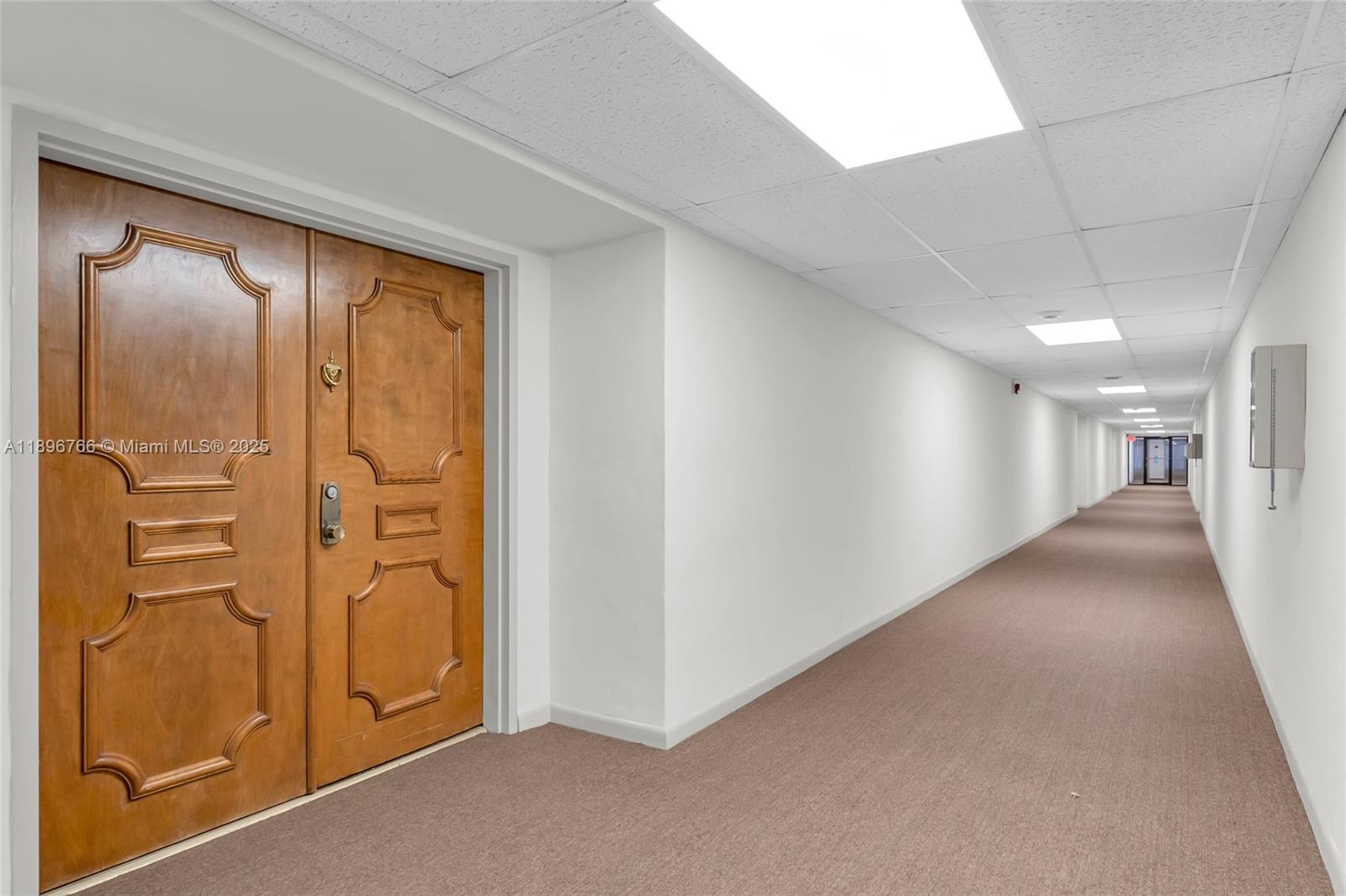 5800 Southwest 127th Avenue, Unit 2203 Miami, FL 33183 - Photo 25 of 32 a view of hallway with livingroom