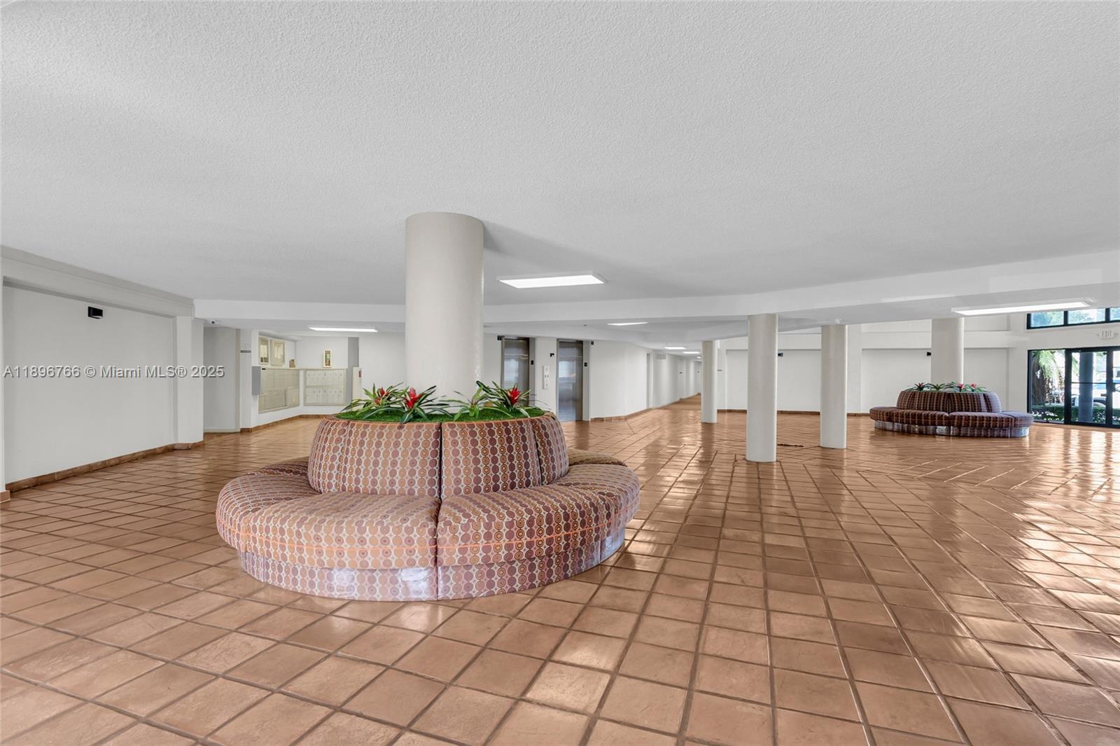 5800 Southwest 127th Avenue, Unit 2203 Miami, FL 33183 - Photo 27 of 32 a living room with furniture and a table