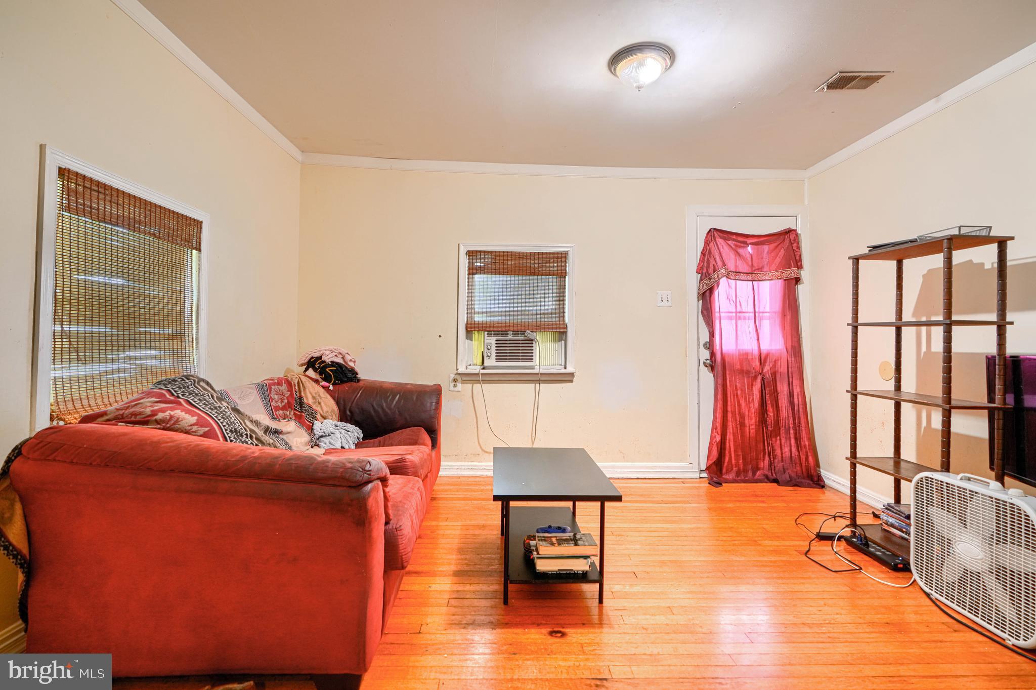 502 Grovethorn Road Middle River, MD 21220 - Photo 5 of 20 a living room with furniture and a window