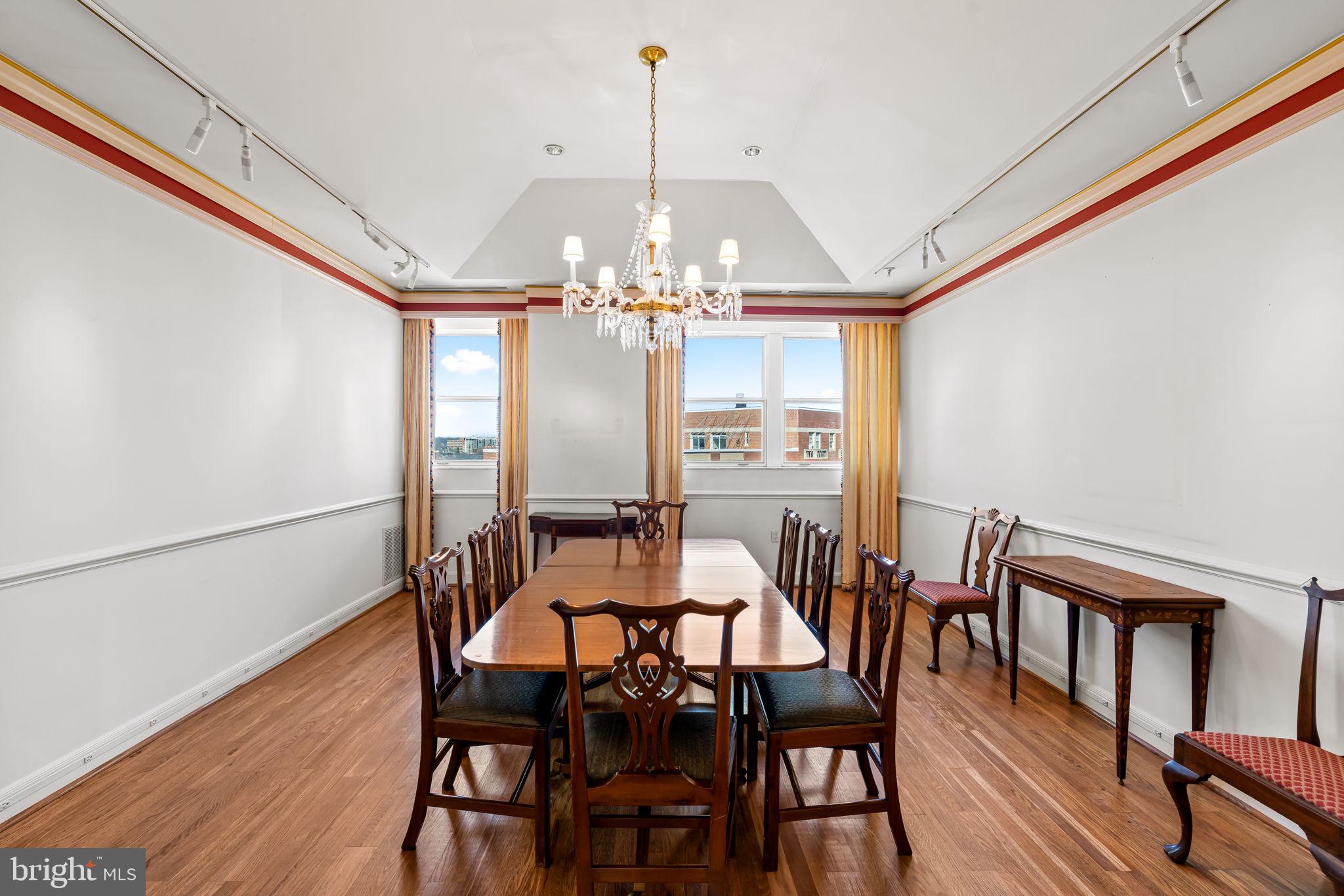 3801 Canterbury Road, Unit 1104 Baltimore, MD 21218 - Photo 15 of 74 a view of a dining room with furniture and wooden floor