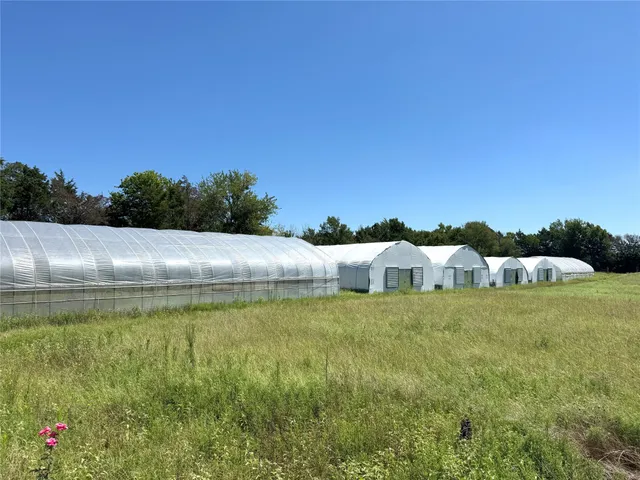 a view of a lake with houses in the background