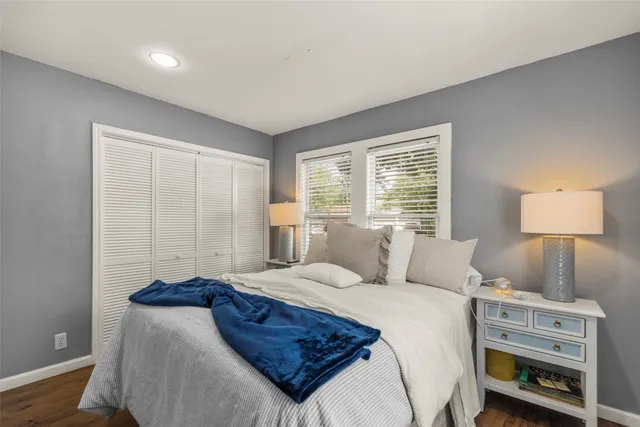 a view of a livingroom with furniture wooden floor and window