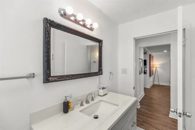 a bedroom with a flat screen tv and a bed