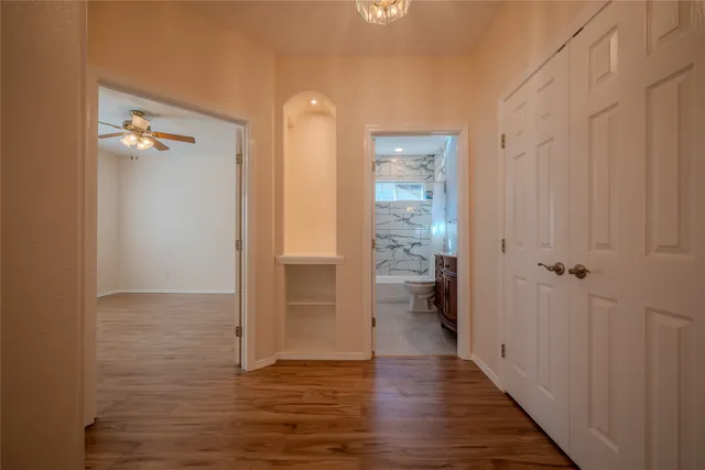 a view of a room with wooden floor