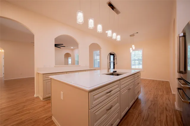 a kitchen with a sink and a refrigerator