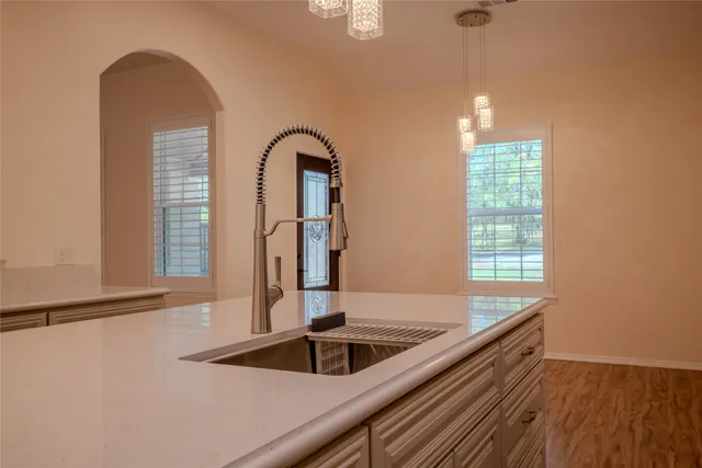 a kitchen with a sink and a window
