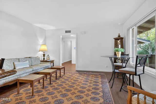 a kitchen with stainless steel appliances granite countertop a stove refrigerator and cabinets