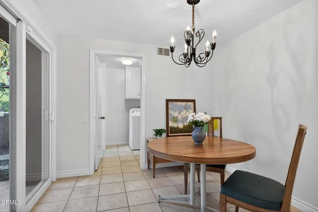 a spacious bedroom with a bed and a large window