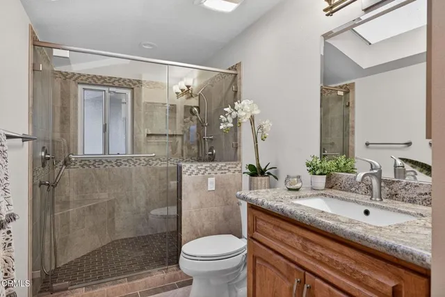 a bedroom with two beds and a window