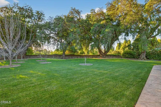 an aerial view of houses with yard