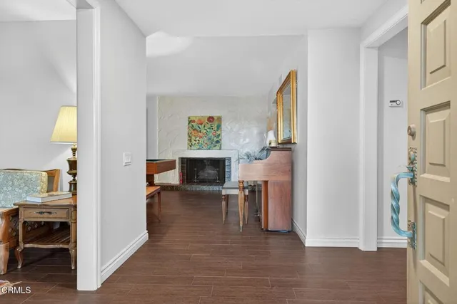 a view of a livingroom with furniture and a fireplace