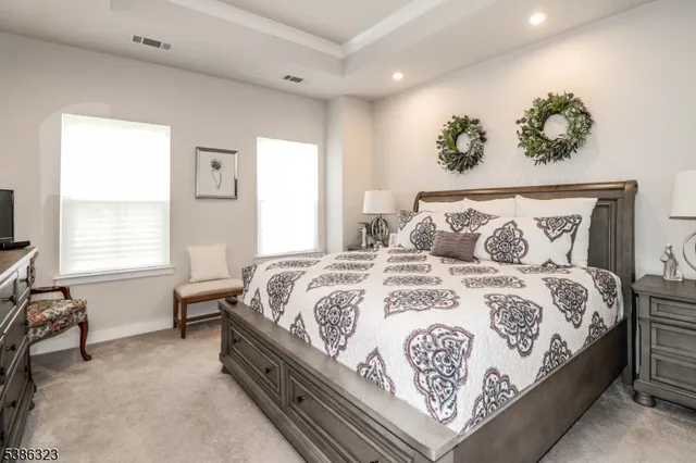 a bedroom with a bed and a couch