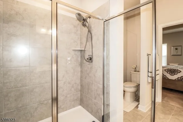 a bathroom with a shower and a toilet