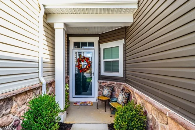 a view of sitting area in front of house