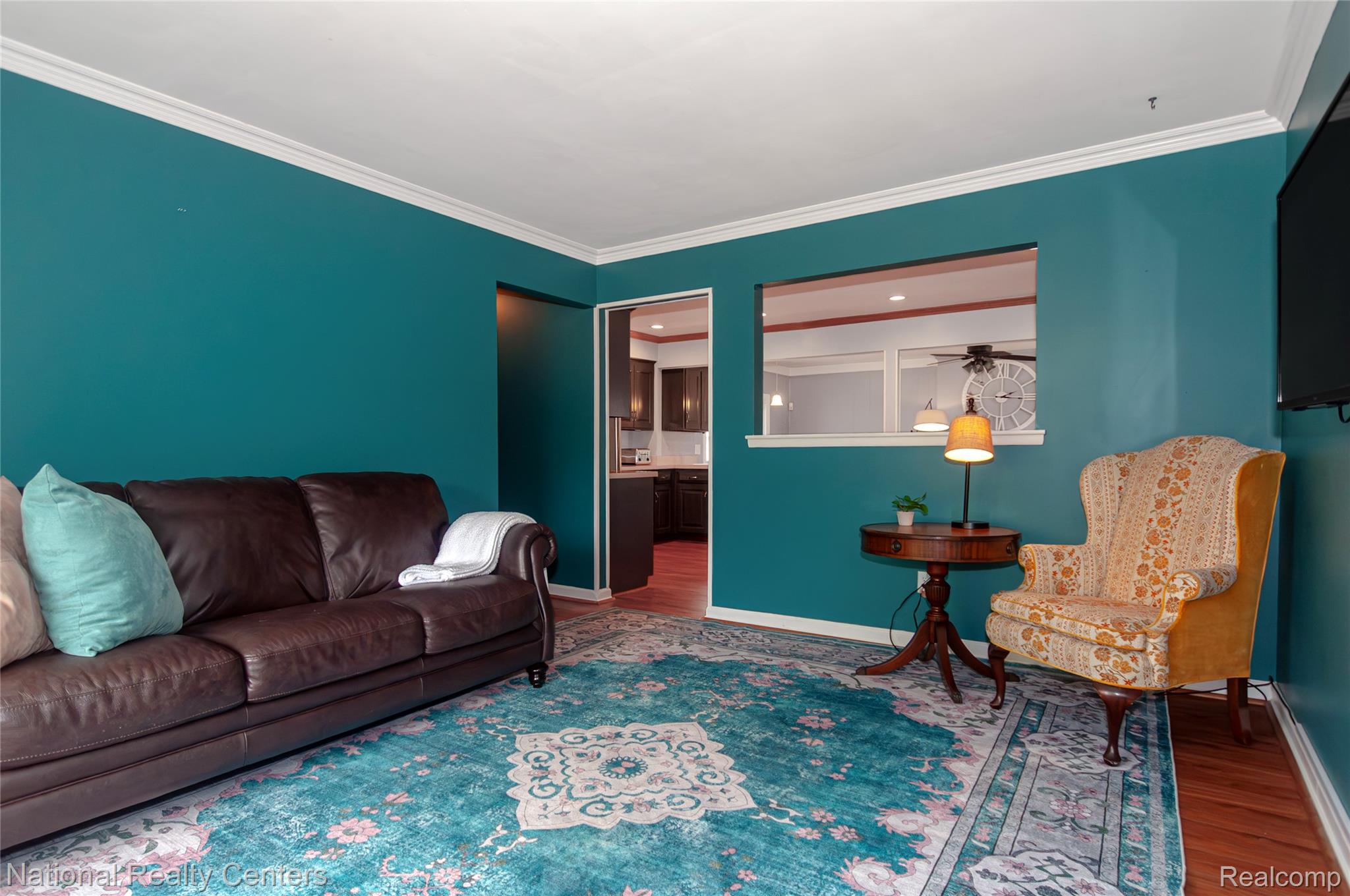 2446 Milverton Road Troy, MI 48083 - Photo 3 of 41 Living area with wood finished floors and crown molding