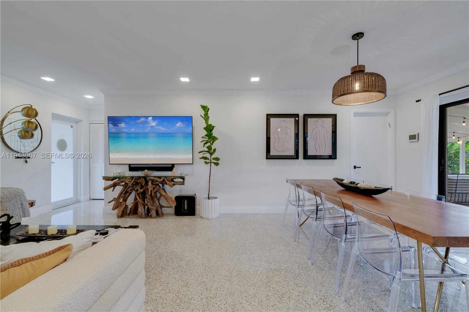 16102 Southwest 98th Avenue Miami, FL 33157 - Photo 15 of 36 Foyer entrance with a coat closet opening up to the living and dining spaces
