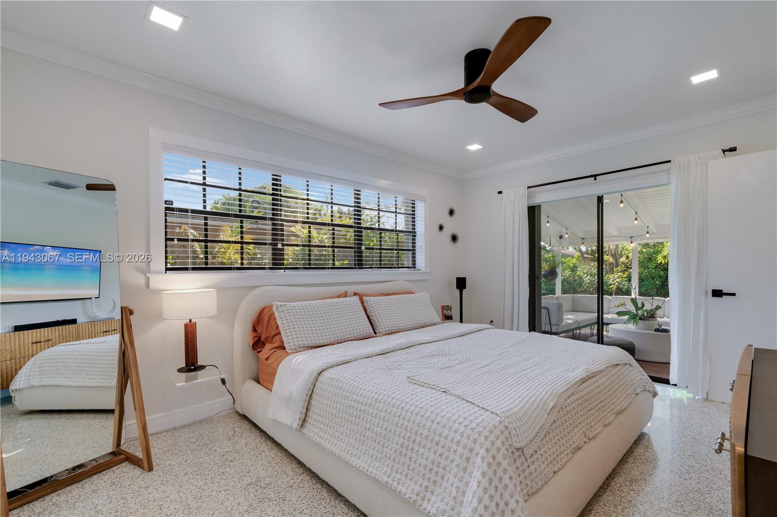16102 Southwest 98th Avenue Miami, FL 33157 - Photo 18 of 36 This main bedroom enjoys private patio access and calming views of the lush tropical backyard and terrace.