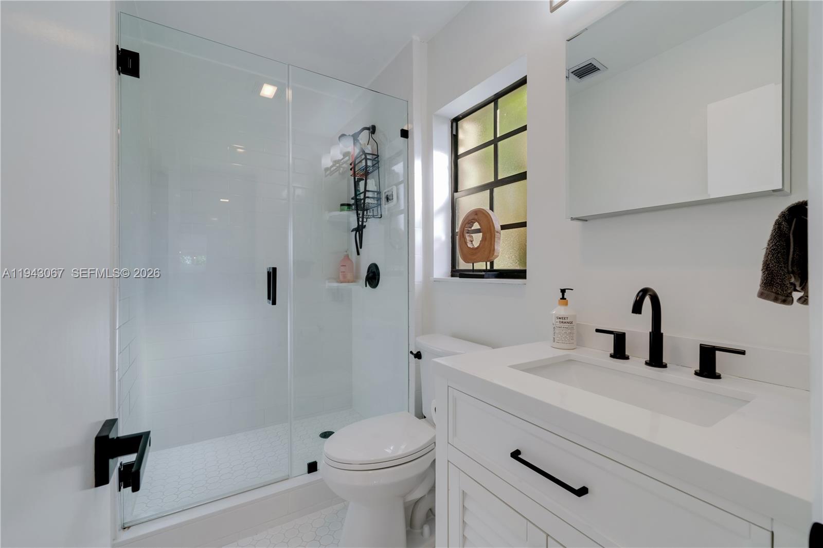 16102 Southwest 98th Avenue Miami, FL 33157 - Photo 19 of 36 Main bathroom in neutral white colors