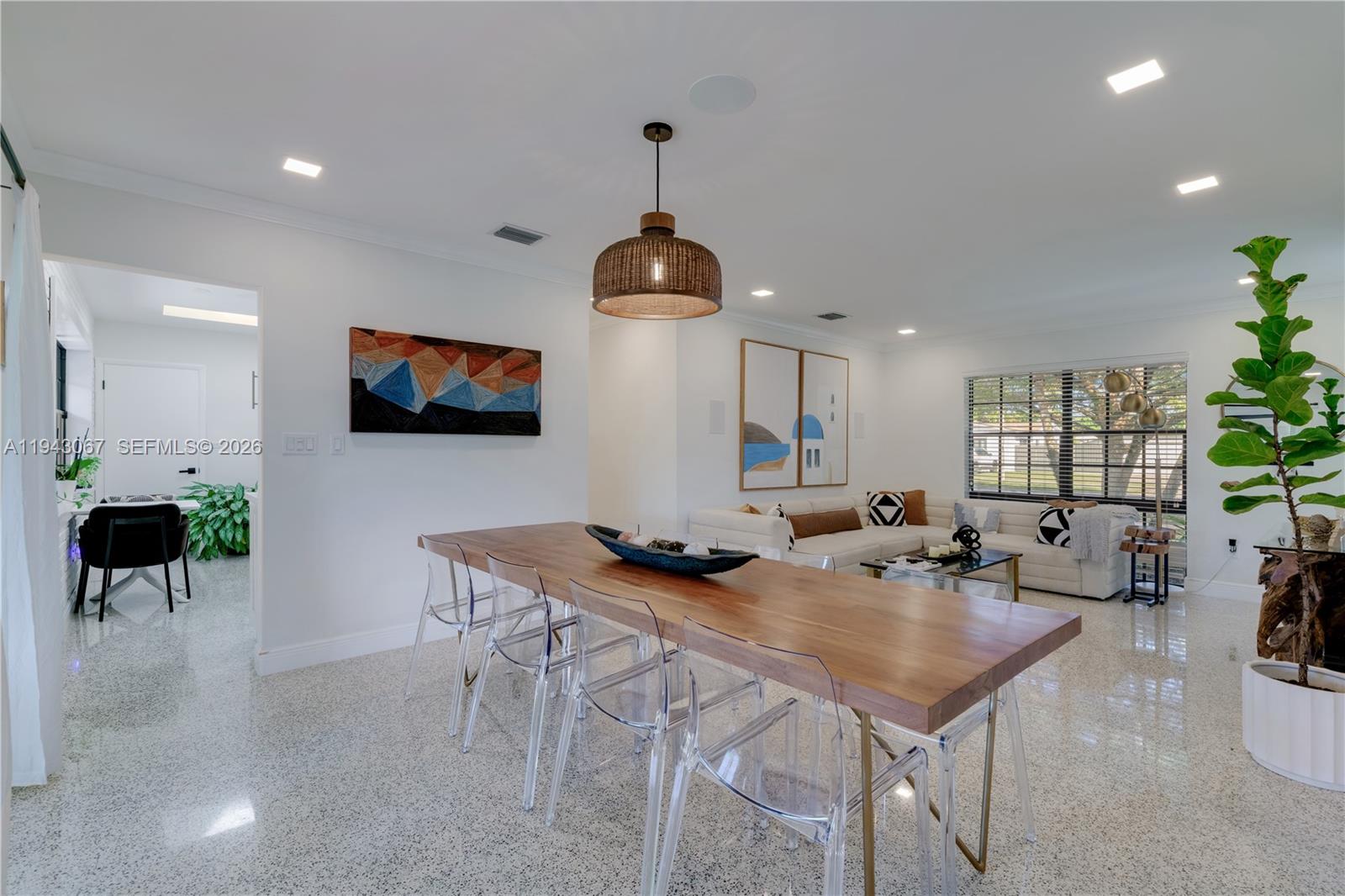 16102 Southwest 98th Avenue Miami, FL 33157 - Photo 20 of 36 Another view showcasing the dining area, living room, and the welcoming entry into the kitchen.