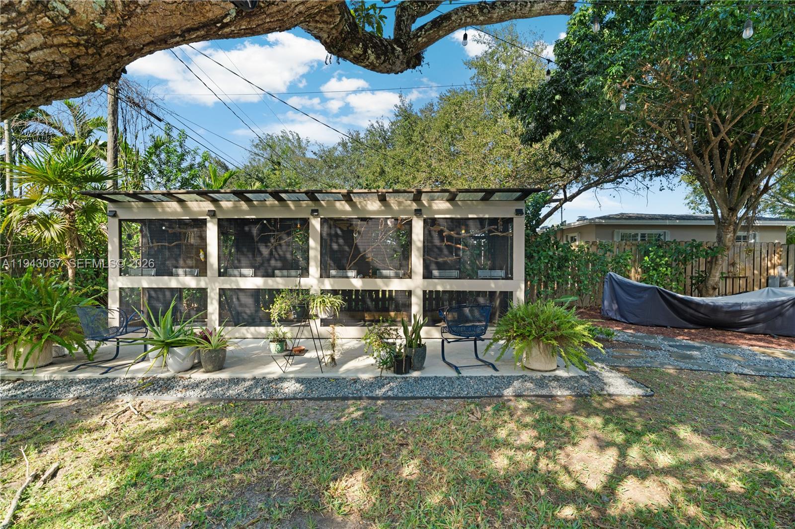 16102 Southwest 98th Avenue Miami, FL 33157 - Photo 4 of 36 Custom built bird house on the north side of the yard