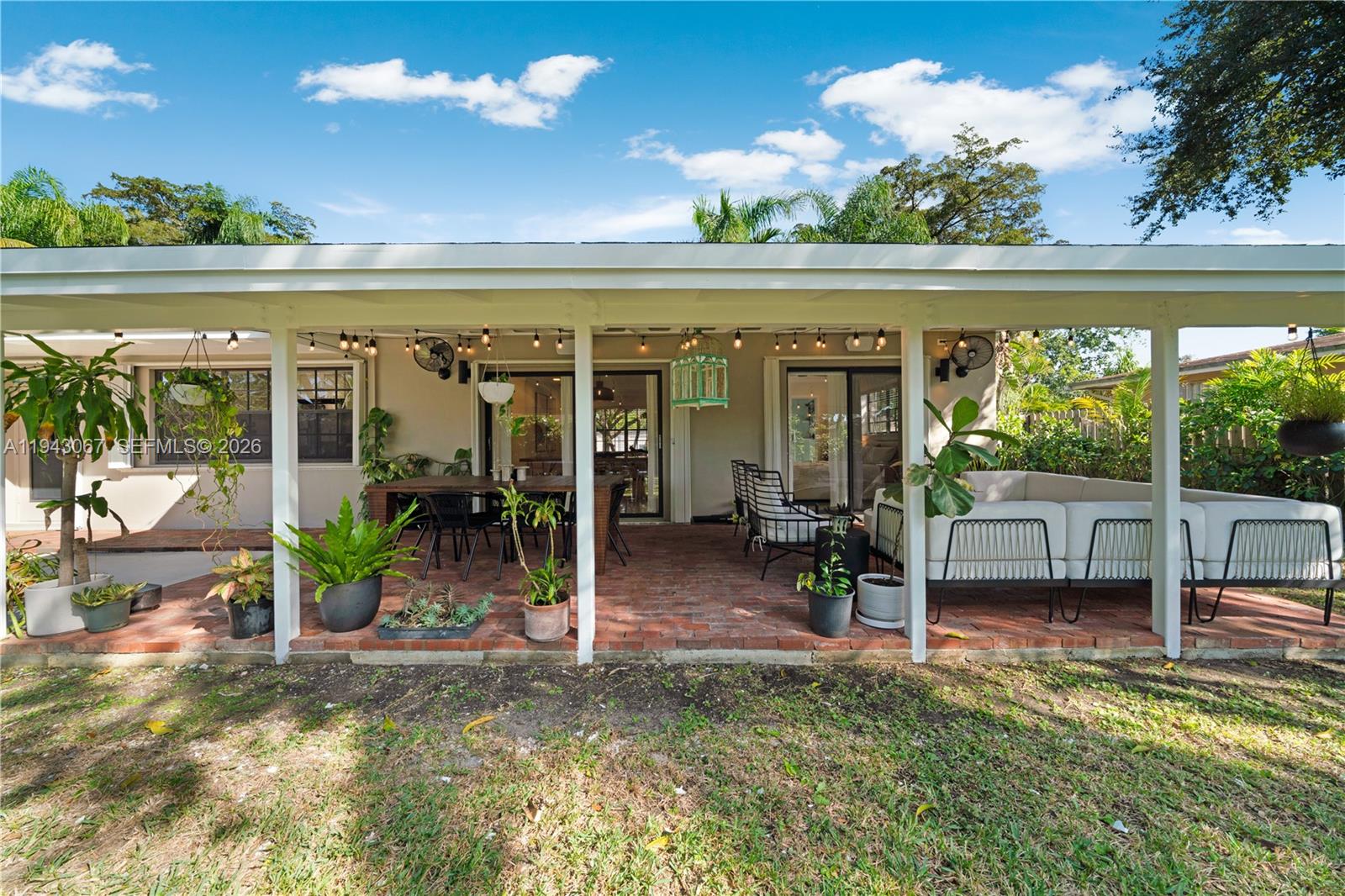16102 Southwest 98th Avenue Miami, FL 33157 - Photo 6 of 36 A custom-designed, wide brick-covered patio offers a spacious, inviting setting perfect for outdoor gatherings.