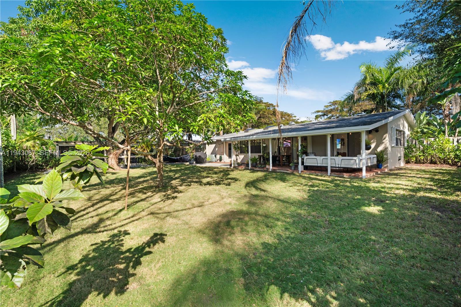 16102 Southwest 98th Avenue Miami, FL 33157 - Photo 7 of 36 The back yard is dotted with some tropical fruit trees