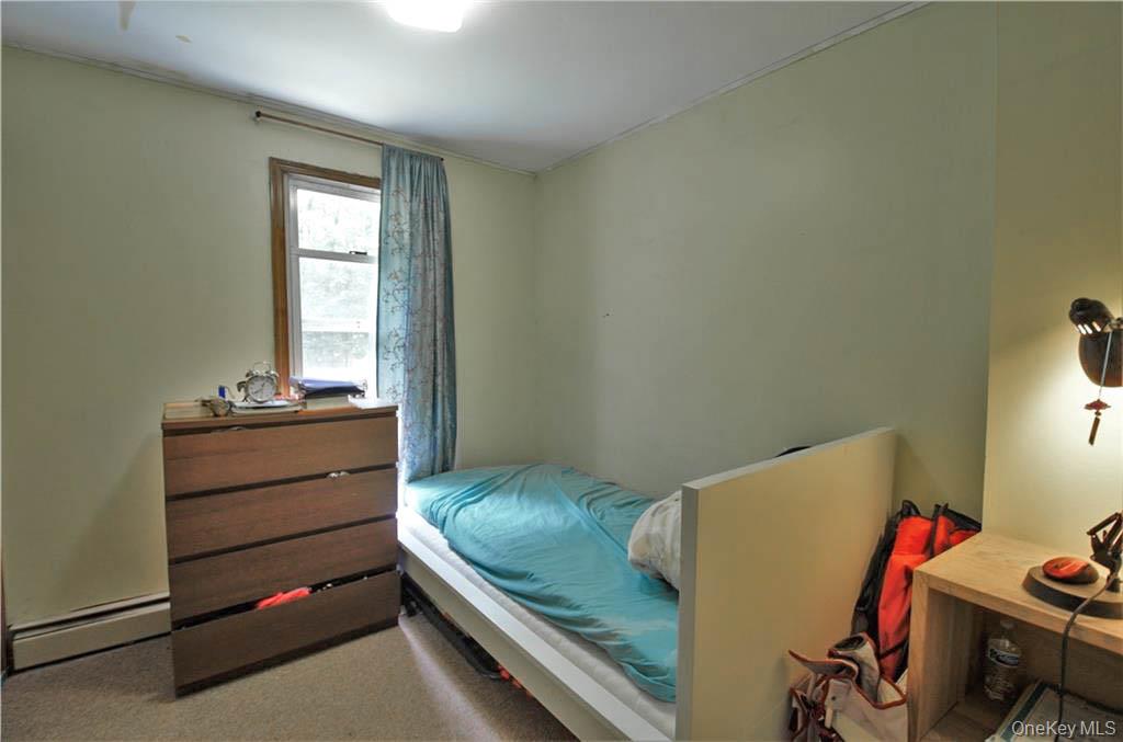 16 Woodland Road Middletown, NY 10940 - Photo 7 of 13 a room with a bed and a window
