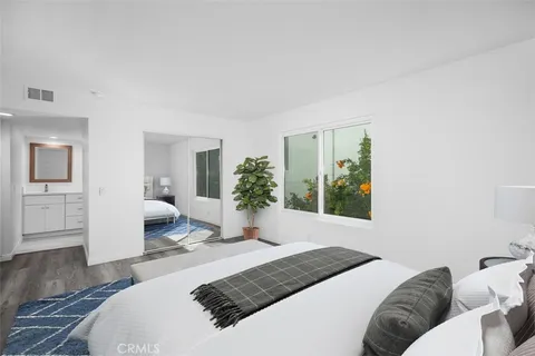 a bathroom with double sink and a mirror