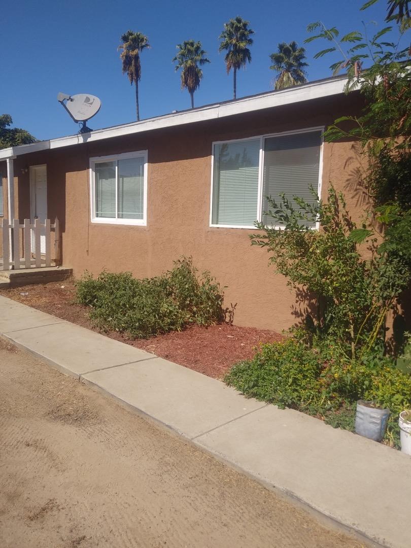 2863 Crest Road Atwater, CA 95301 - Photo 2 of 4 a front view of a house with a yard and garage