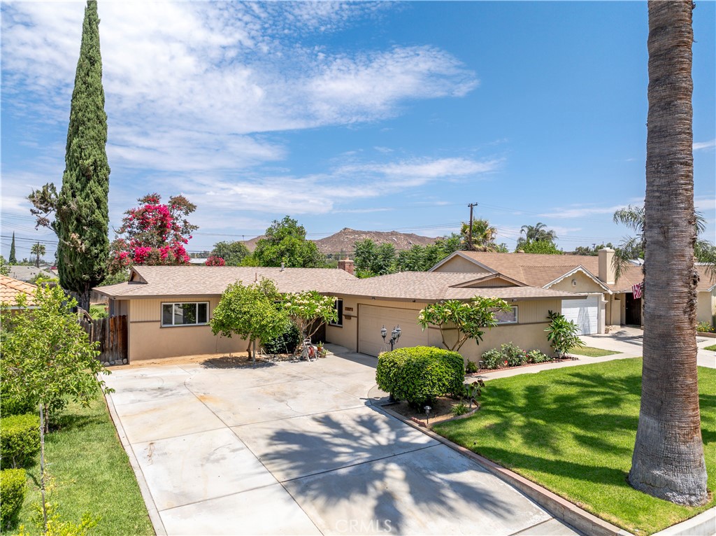 10409 Pendleton Street Riverside, CA 92505 - Photo 6 of 35 a front view of a house with a yard