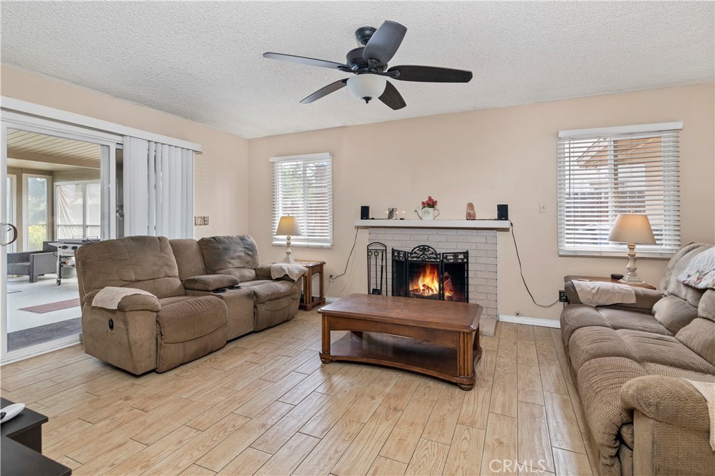10409 Pendleton Street Riverside, CA 92505 - Photo 9 of 35 a living room with furniture and a fireplace