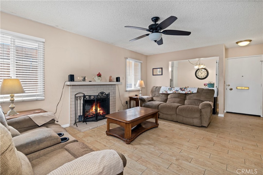 10409 Pendleton Street Riverside, CA 92505 - Photo 10 of 35 a living room with furniture and a fireplace
