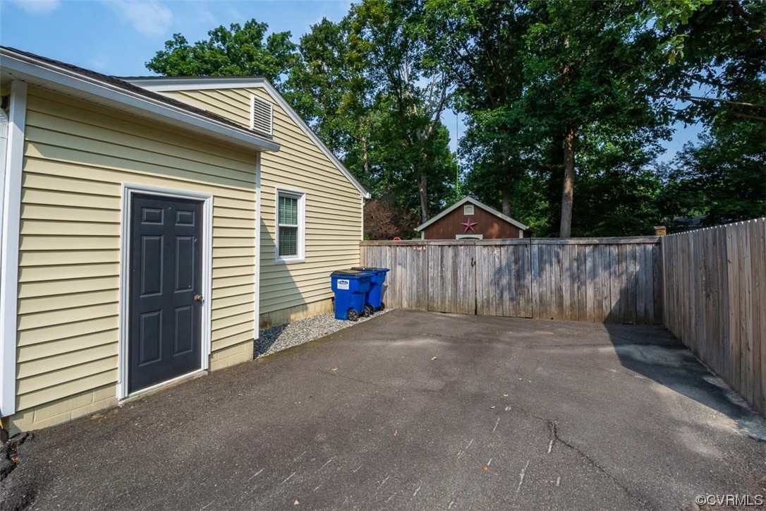 4648 Brookridge Road Chesterfield, VA 23832 - Photo 11 of 50 a view of back yard and wooden fence