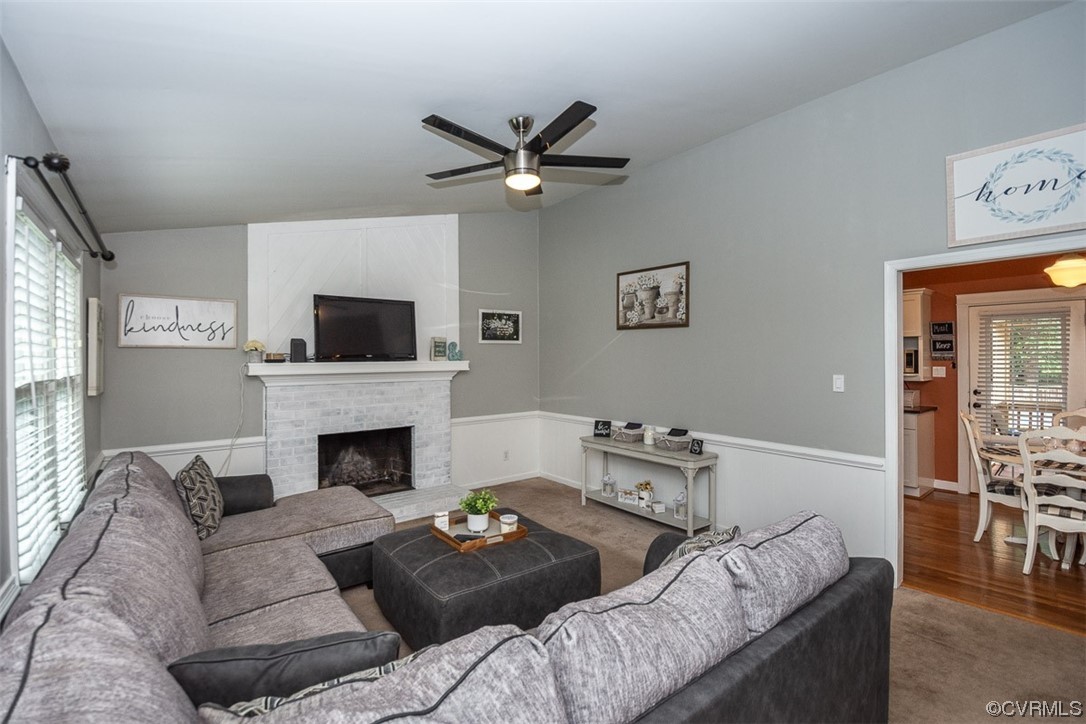 4648 Brookridge Road Chesterfield, VA 23832 - Photo 12 of 50 a living room with furniture a fireplace and a flat screen tv