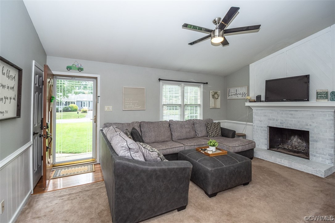 4648 Brookridge Road Chesterfield, VA 23832 - Photo 14 of 50 a living room with furniture a fireplace and a flat screen tv
