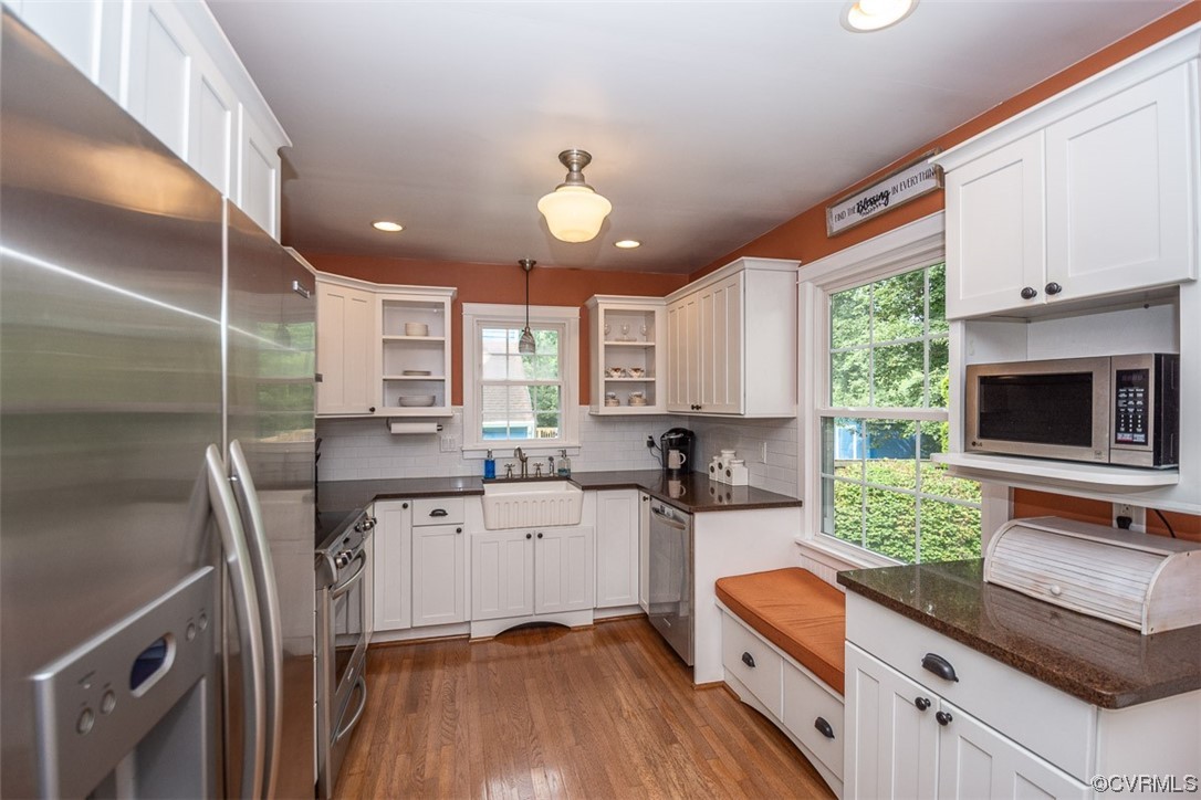 4648 Brookridge Road Chesterfield, VA 23832 - Photo 18 of 50 a kitchen with stainless steel appliances a stove a sink a microwave a refrigerator and cabinets