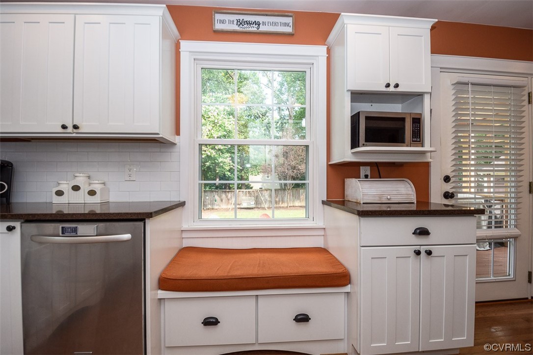 4648 Brookridge Road Chesterfield, VA 23832 - Photo 19 of 50 a kitchen with stainless steel appliances wooden cabinets and a stove top oven