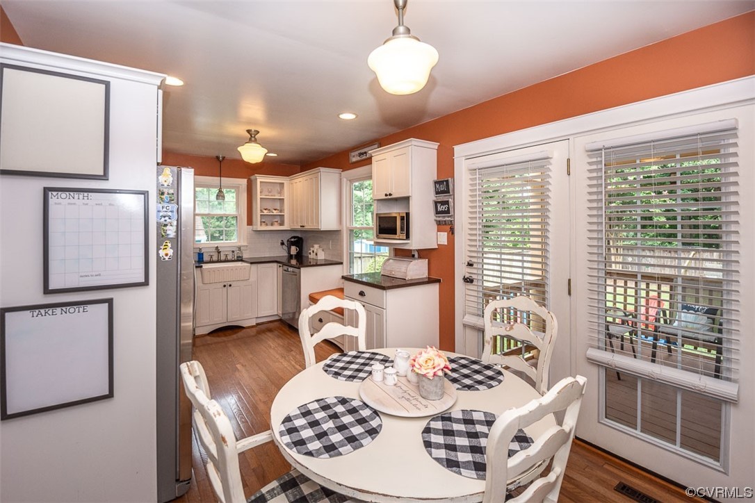 4648 Brookridge Road Chesterfield, VA 23832 - Photo 21 of 50 a kitchen with a table chairs refrigerator and microwave