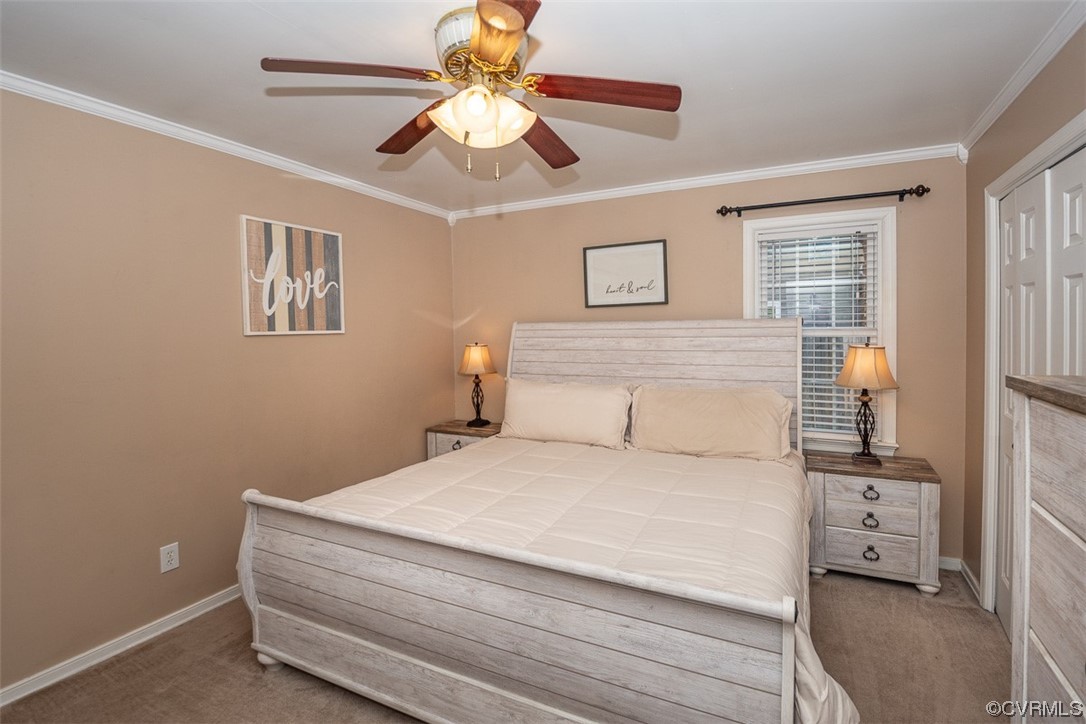 4648 Brookridge Road Chesterfield, VA 23832 - Photo 26 of 50 a bedroom with a large bed and a ceiling fan