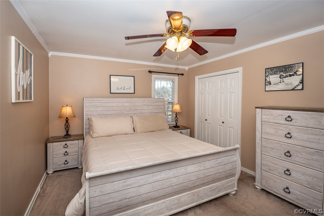 4648 Brookridge Road Chesterfield, VA 23832 - Photo 27 of 50 a bedroom with a bed and a chandelier