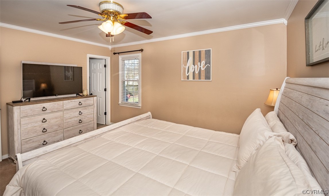 4648 Brookridge Road Chesterfield, VA 23832 - Photo 28 of 50 a bedroom with a bed and a flat screen tv