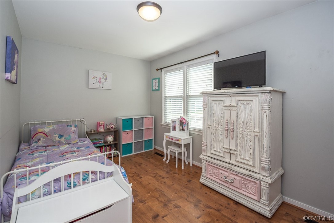4648 Brookridge Road Chesterfield, VA 23832 - Photo 29 of 50 a bedroom with furniture and a flat screen tv
