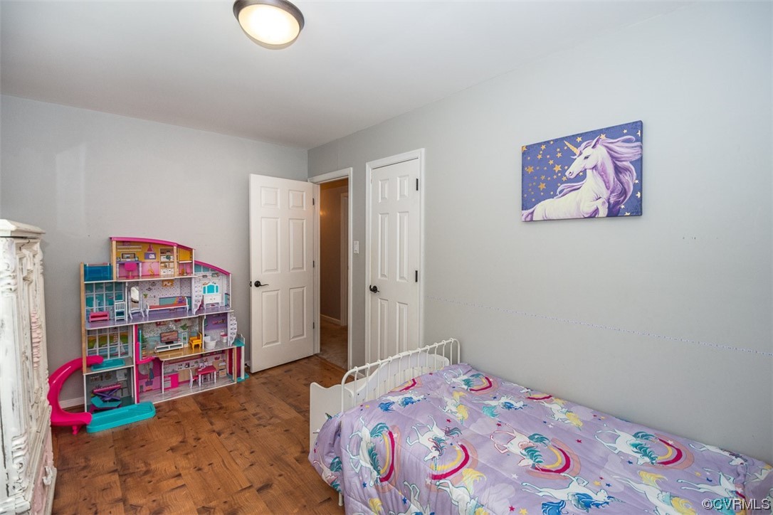4648 Brookridge Road Chesterfield, VA 23832 - Photo 33 of 50 a bedroom with bed and book shelf