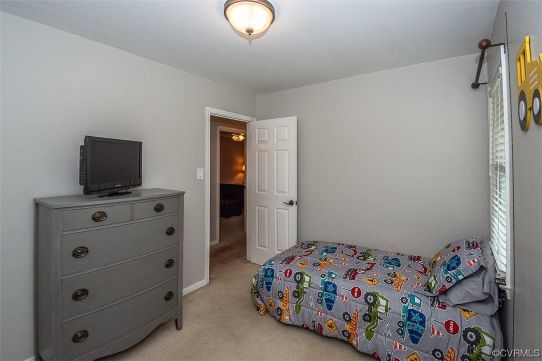 4648 Brookridge Road Chesterfield, VA 23832 - Photo 35 of 50 a bedroom with a bed and a dresser in it