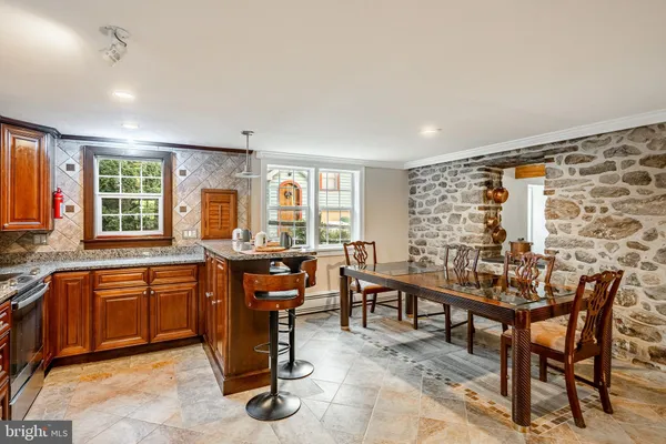 a view of a dining room with furniture window and outside view