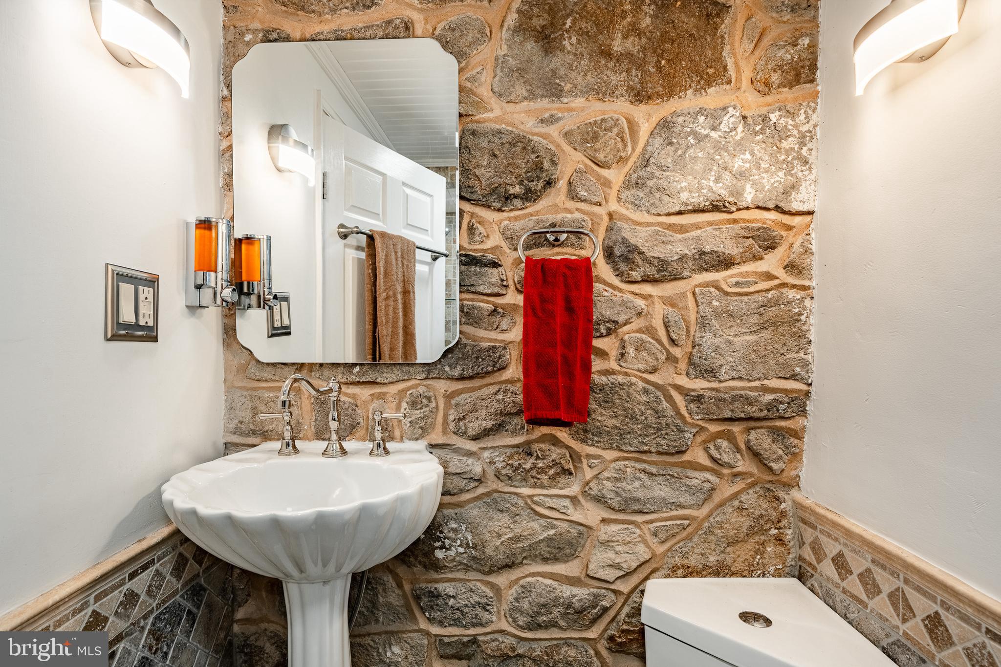 59 East Main Street Elverson, PA 19520 - Photo 15 of 43 a bathroom with a sink and a mirror