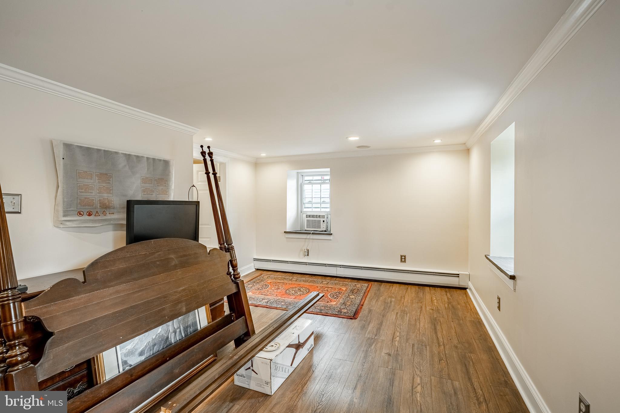 59 East Main Street Elverson, PA 19520 - Photo 23 of 43 a bedroom with furniture and wooden floor